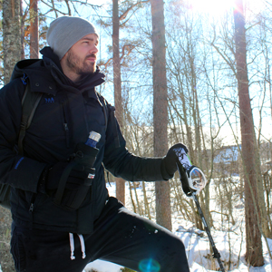 Picture of Chris holding a Wild Wolf Outfitters water bottle carrier in snowy landscape in Sweden